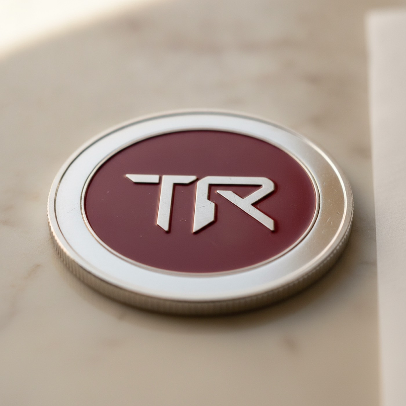 Close-up macro shot of a TRON coin showing the engraved triangular mark